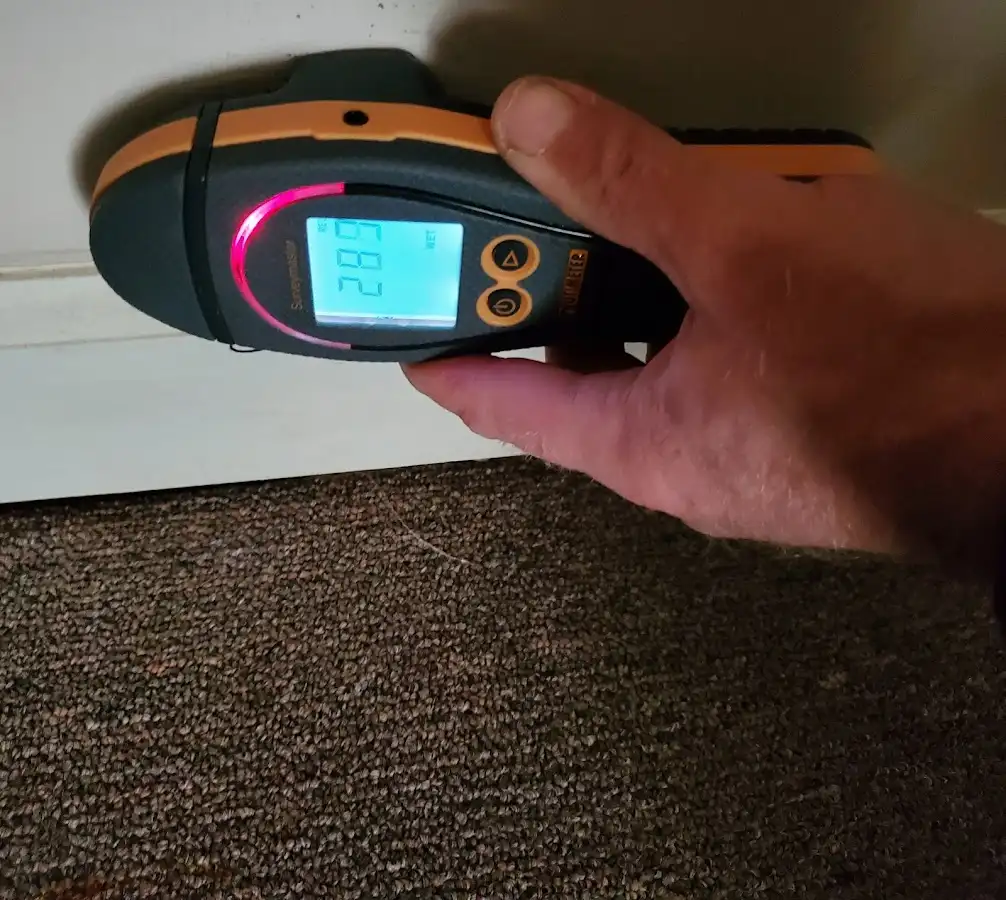 Moisture detection at baseboard during Storm Damage Restoration in Homestead Meadows South